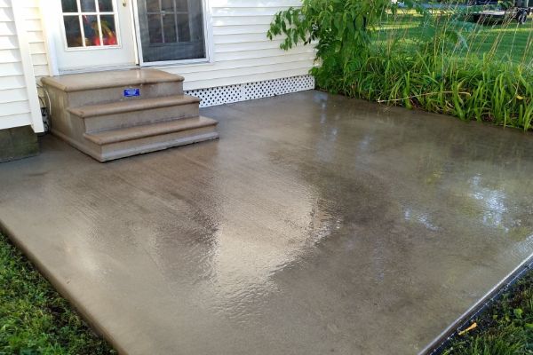patio and steps outside of white home after cleaning