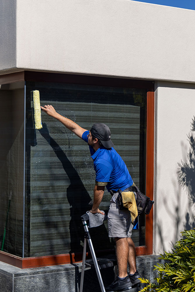 window cleaning professional cleaning exterior window on commercial property