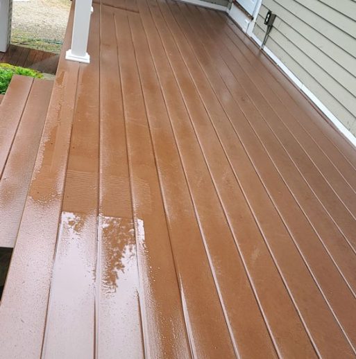 wooden deck after cleaning and restoration on beige home