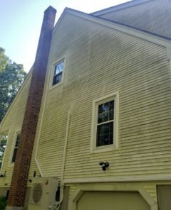 siding of white home before cleaning